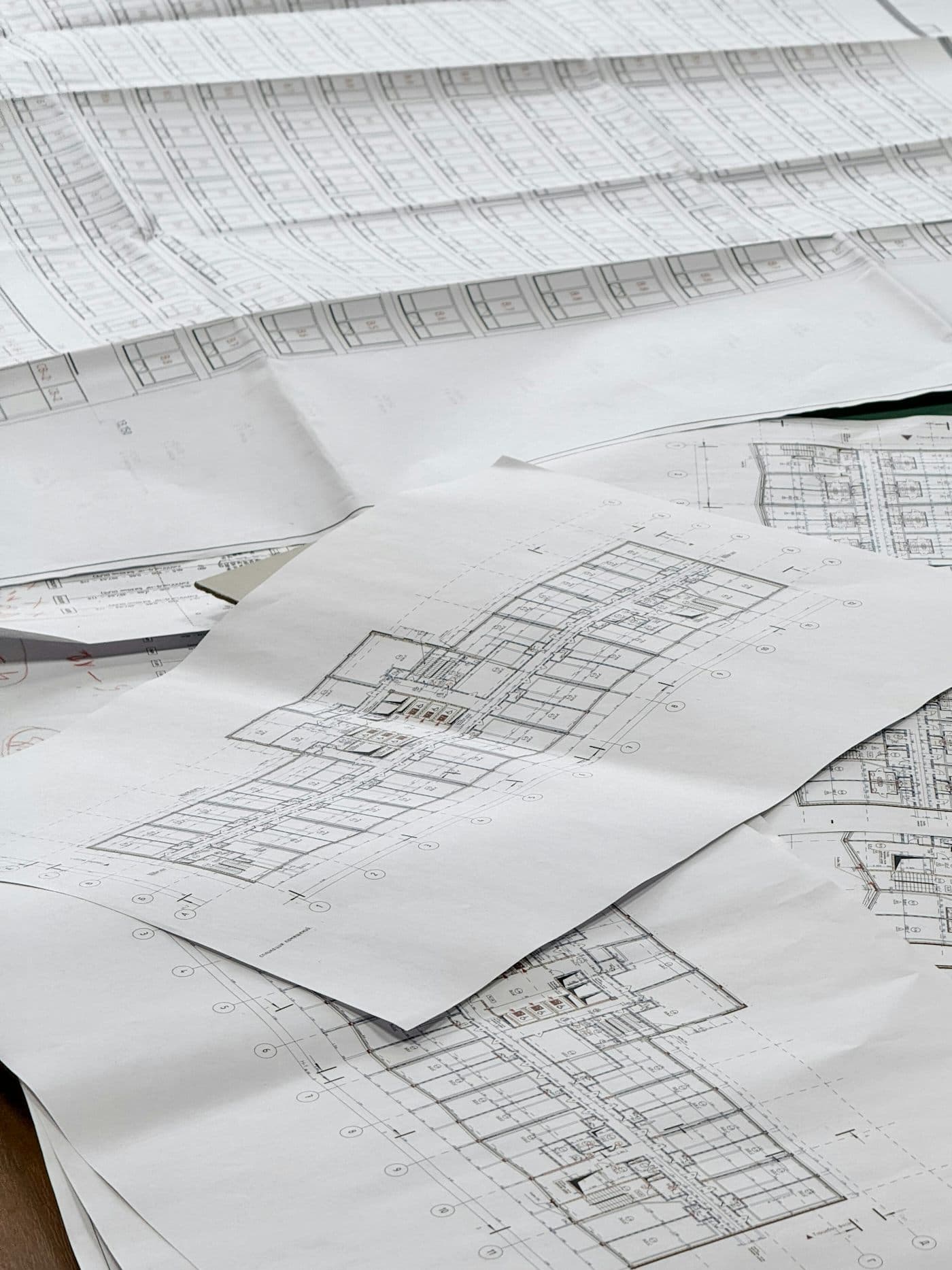 Architectural drawings spread across a desk